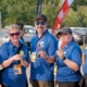 Five volunteers hold up freezies at the 2024 BC Summer Games